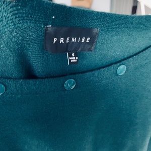 Soft green sweater.  52% viscose, 28% polyester, 20% rayon. Hand wash cold.